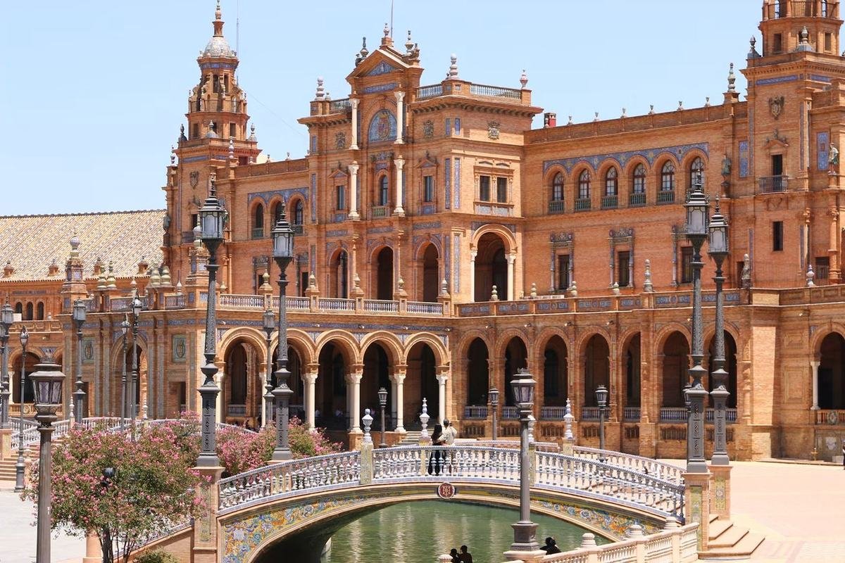 Plaza de España in Seville, with its tiled bridge and brick arcades